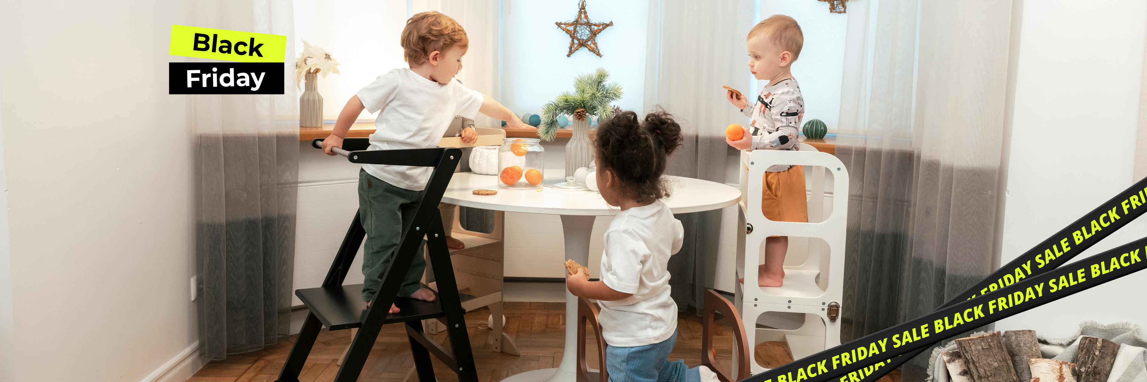 Children playing at a dining table with promotional text for Black Friday sale.